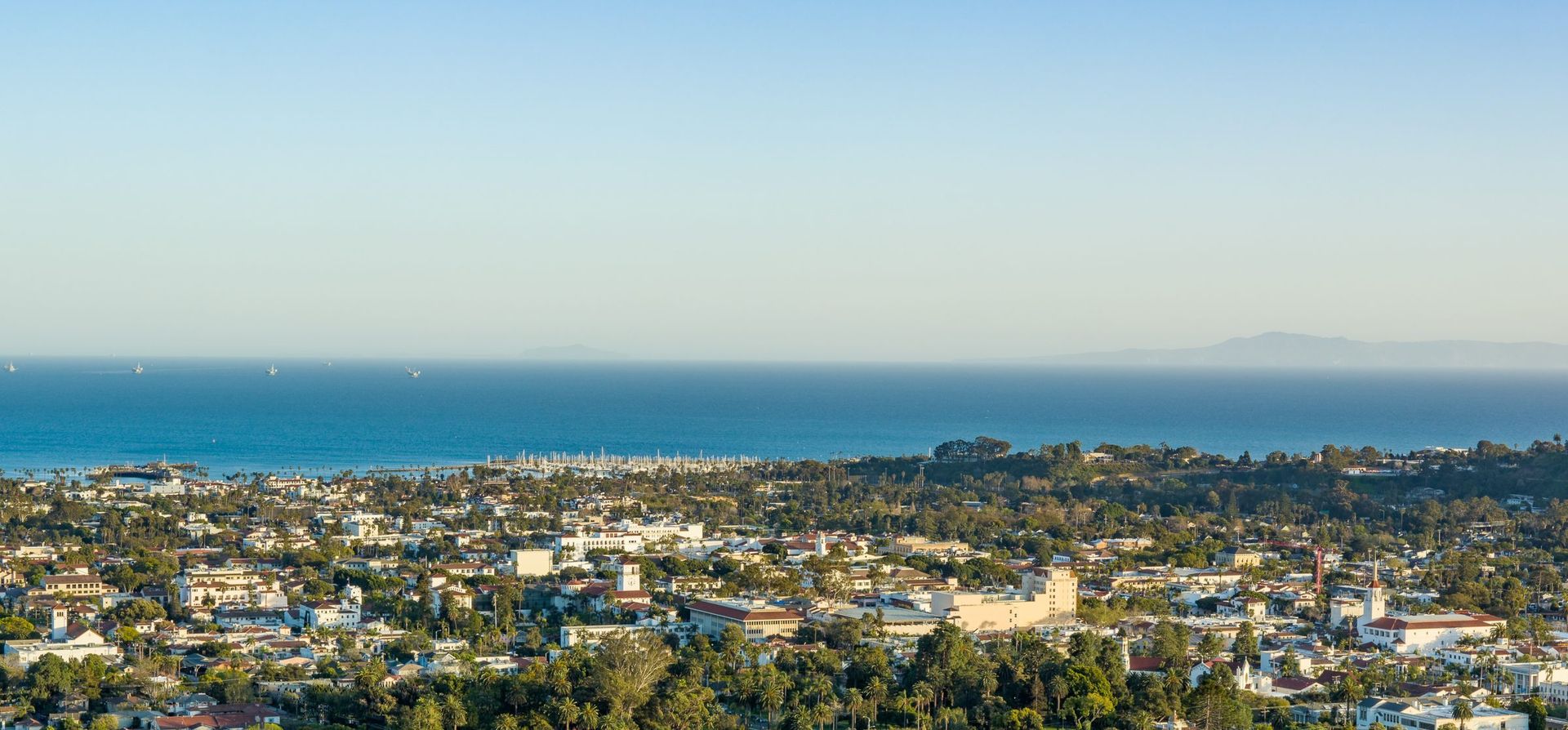 Aerial view over State Street and downtown Santa Barbara to the harbor